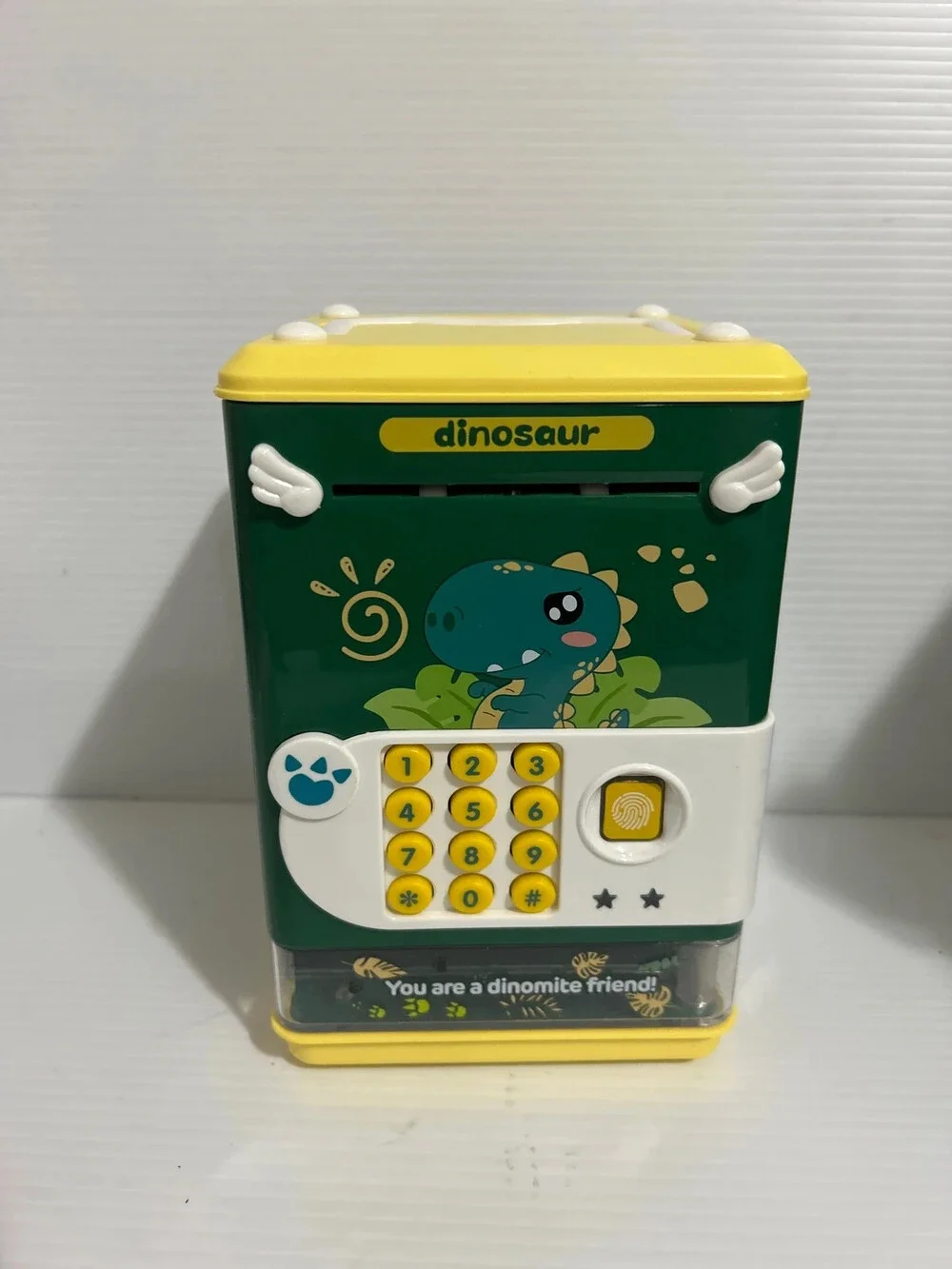 Título Dinosaur Electronic Piggy Bank Password Safe Coin & Cash Saving Box for